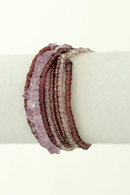 Stretchy beaded bracelet in a delicate mix of lilacs, berry and crystal coloured beads.