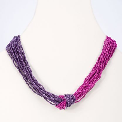 Medium length seed bead necklace in a knot of fuchsia and purple seed beads.